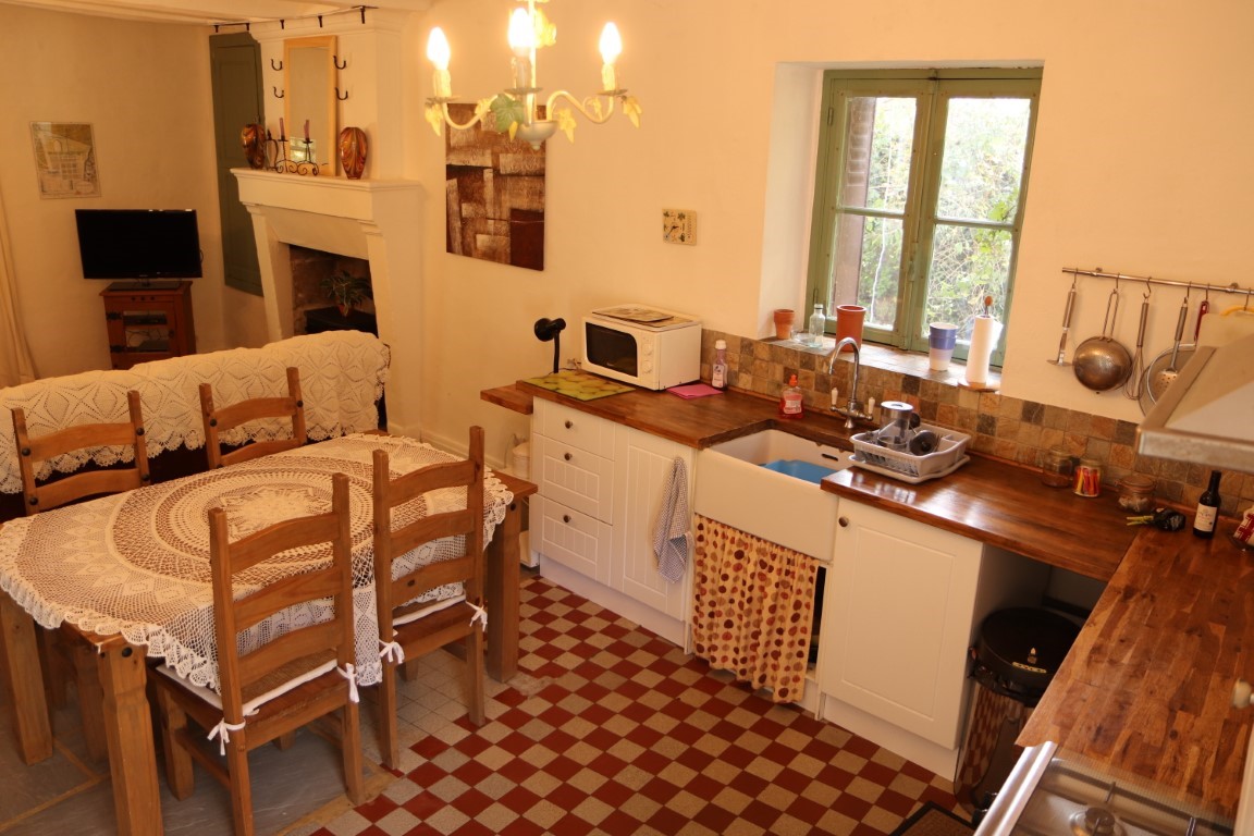 Gite farmhouse kitchen with checkerboard floor at Moulin St Blaise